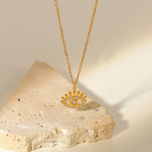 Golden evil eye white stones necklace
