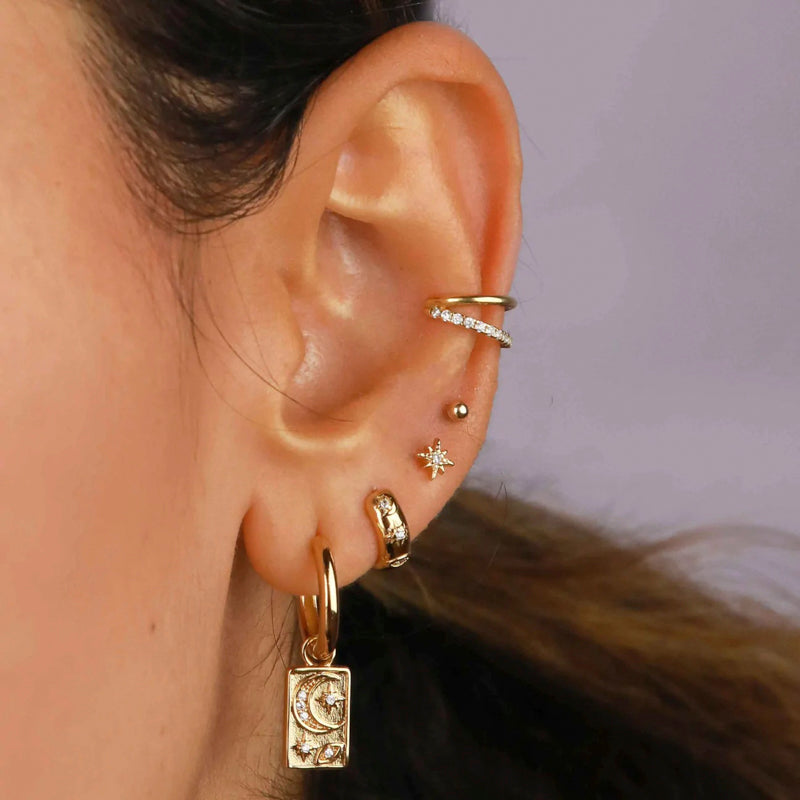 Fancy chunky golden earring with traditional engravings
