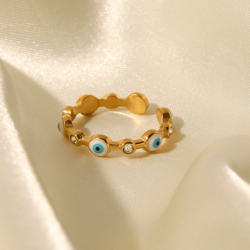 Evil blue eye motif on golden ring