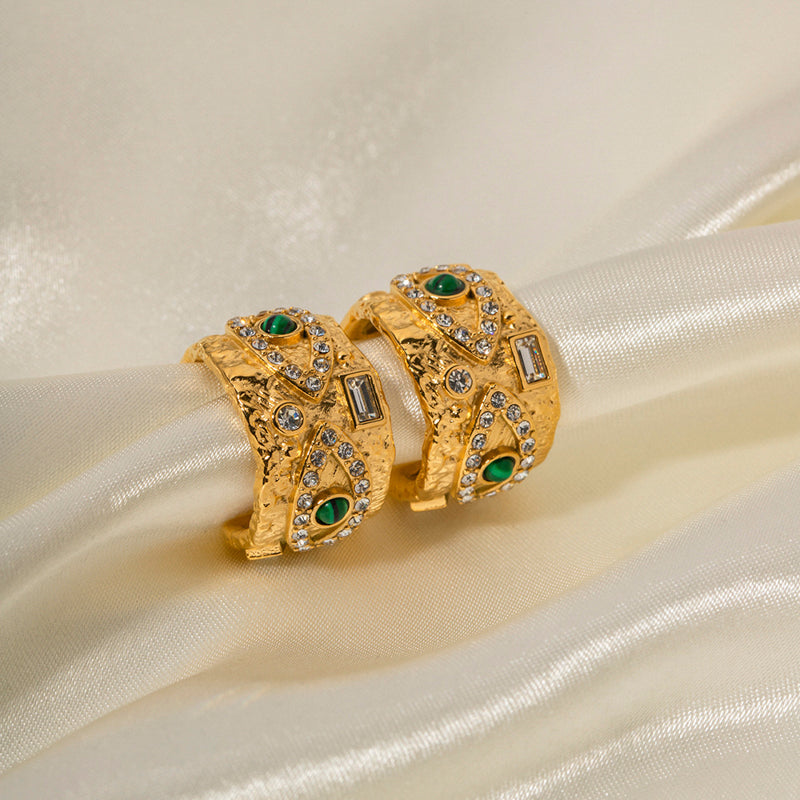 Emerald and white stones jeweled eye on golden earring