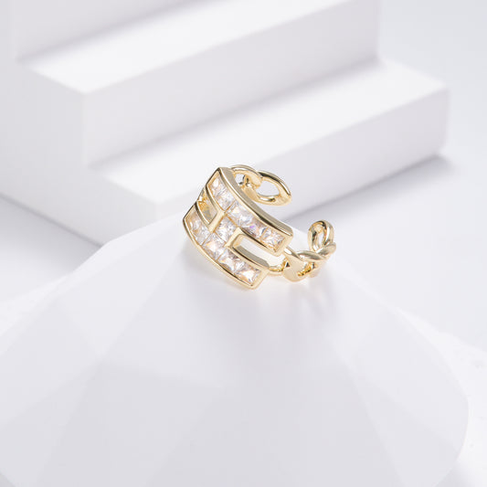 H-shaped golden ring with ravishing white stones