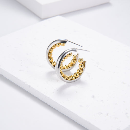 Golden beads on silver circular earrings