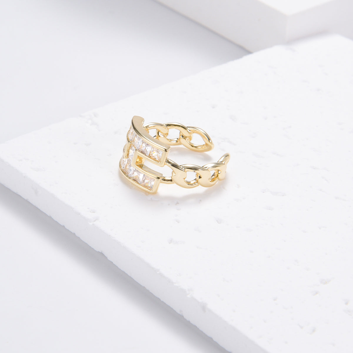 H-shaped golden ring with ravishing white stones