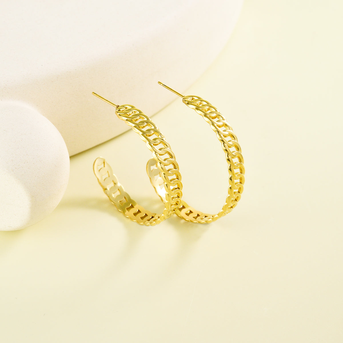 Large sized golden earrings with chain design