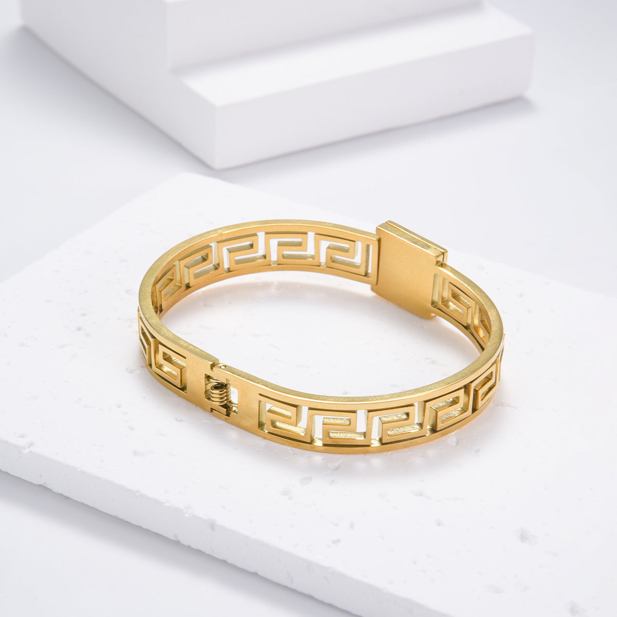 Engraved gold bracelet with black and gold motif