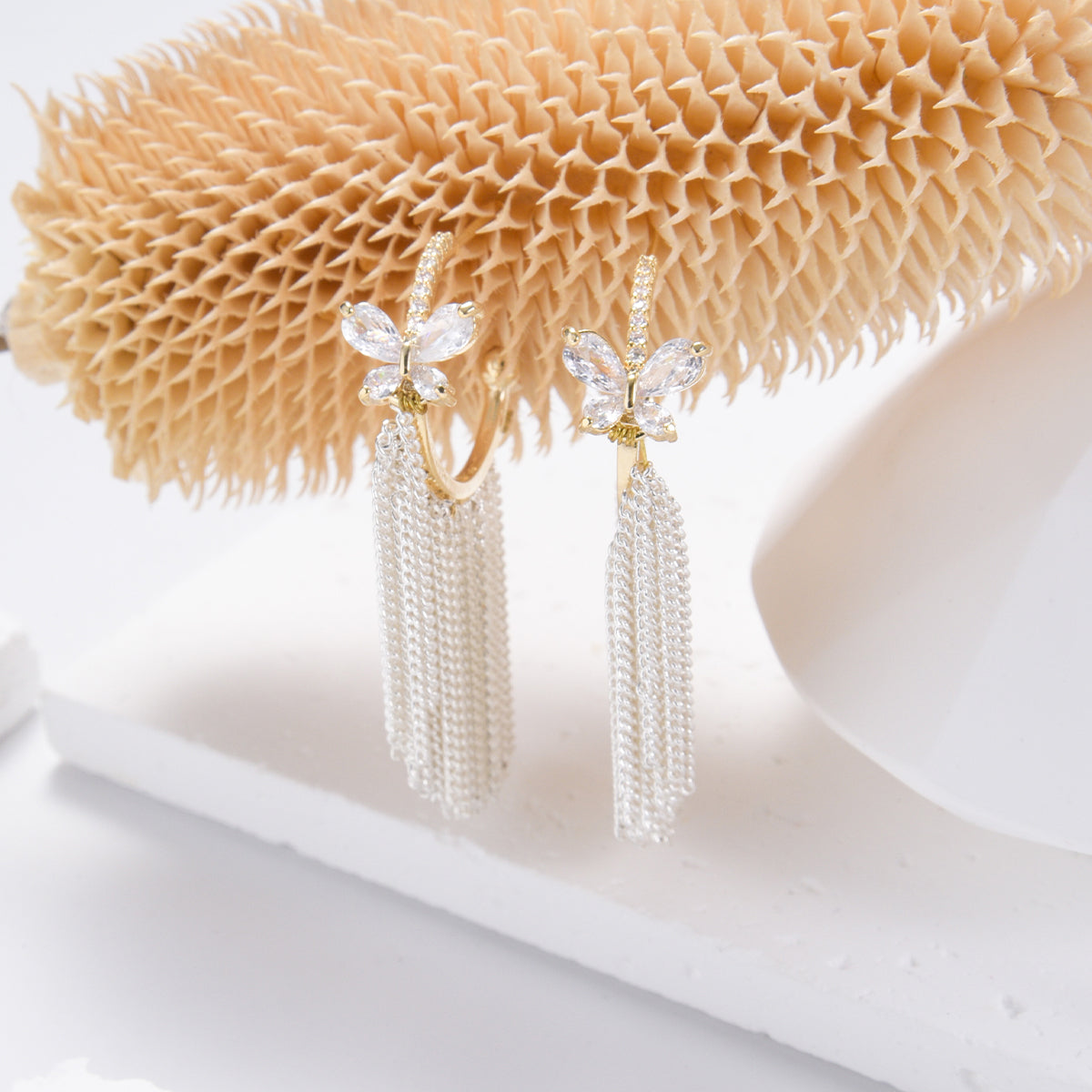 Classic golden butterfly earrings with silver tassels