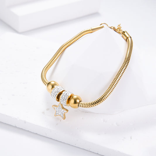 Star-studded pendant on golden bracelet