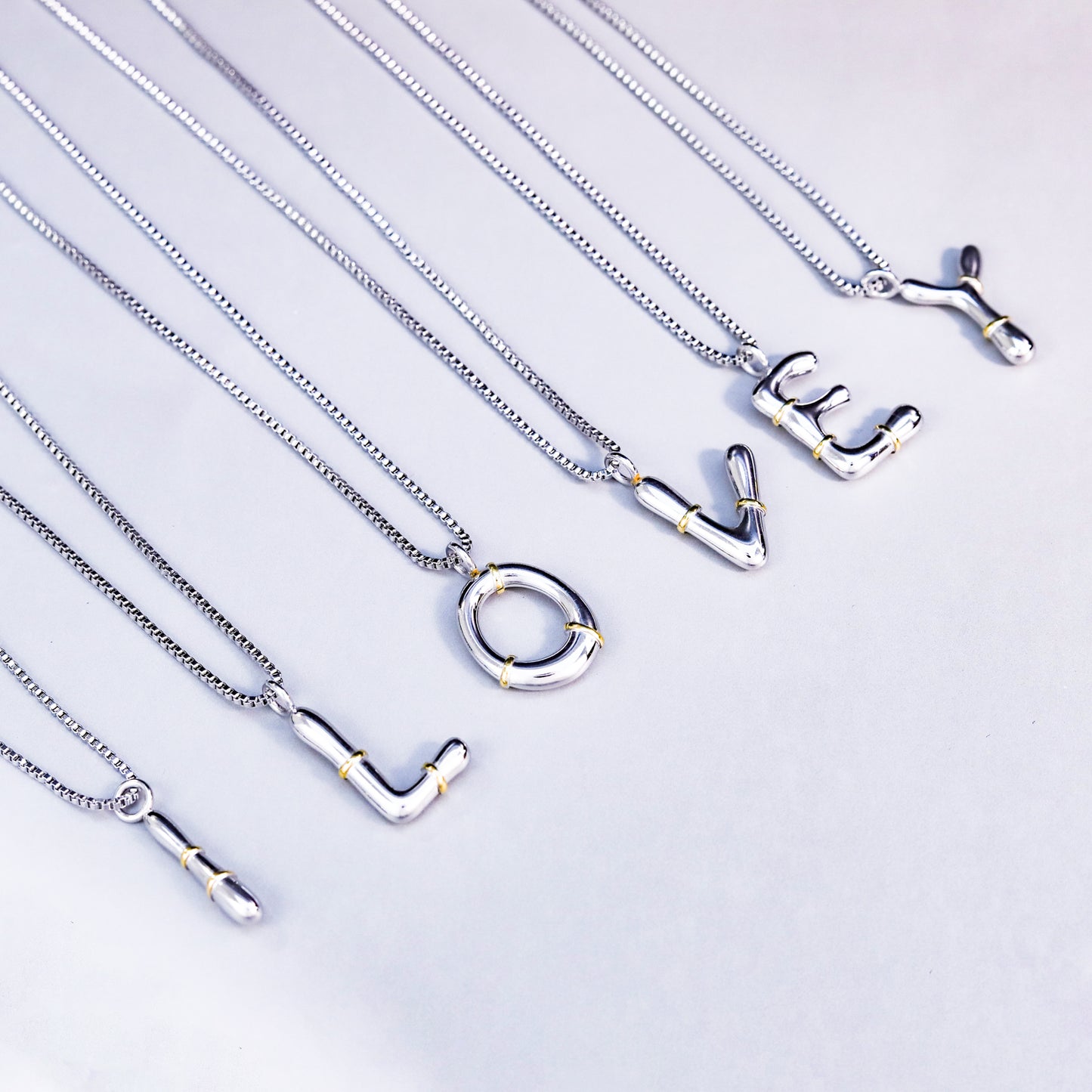 Silver Letter Necklaces with Unique Design and Gold Accents