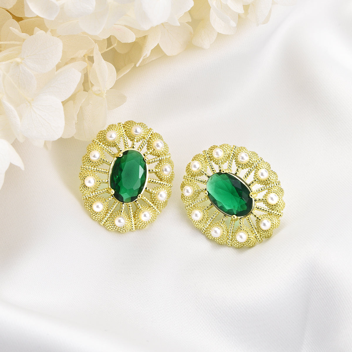 Fancy green peacock design on golden earrings